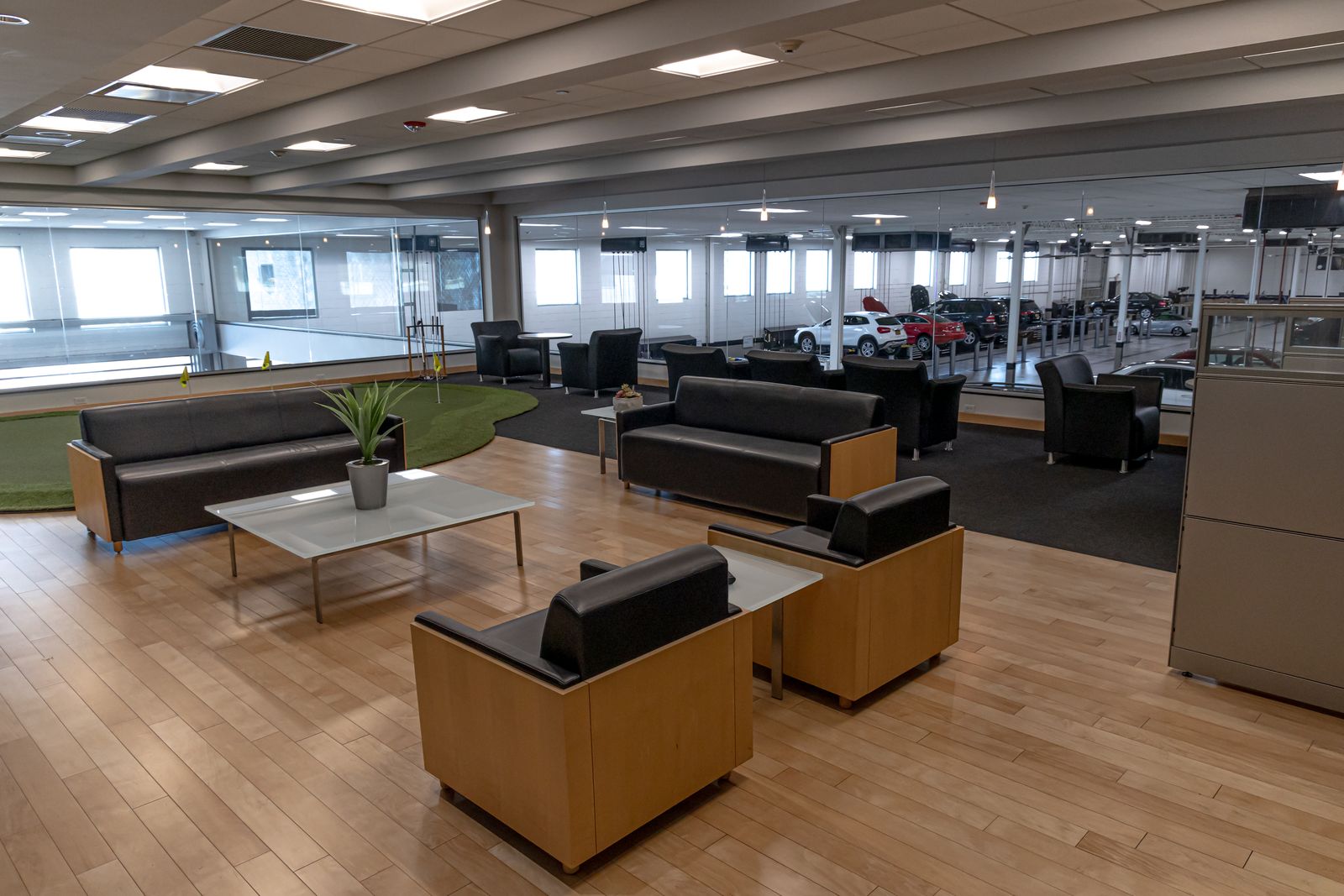 Customer lounge with an indoor putting green