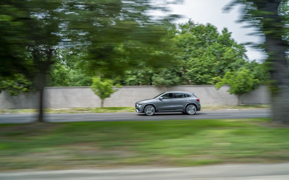 Mercedes-AMG GLA 35 SUV driving along a suburban road